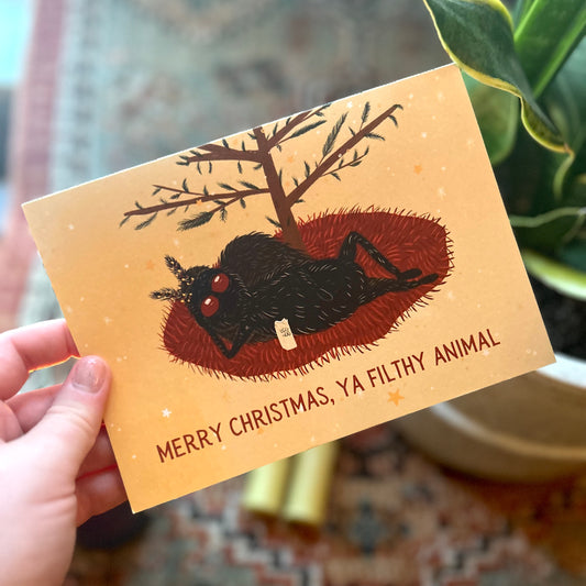 Mothman Christmas Card: Festive Eggnog Sip & Cheeky Greeting!